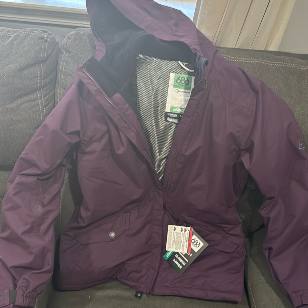 Plum size large winter coat has some inside pockets and ventilators